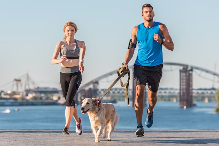 Photo of Couple And Dog Jogging
