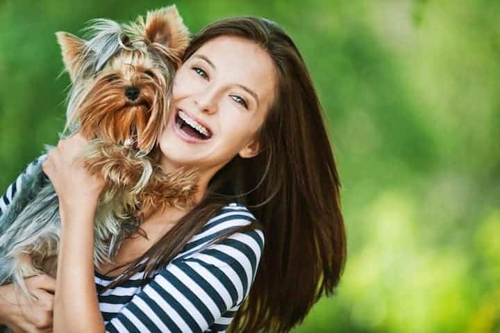 Photo of Happy Woman With Yorkie Min