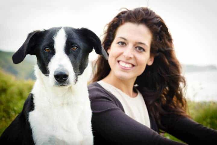 Photo of Pretty Woman With Back And White Dog