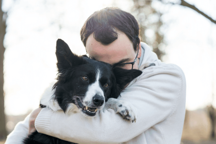 Photo of Dog And Owner Hugging
